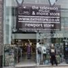 Our volunteer EJ stood outside the new Tv Music and Movie store